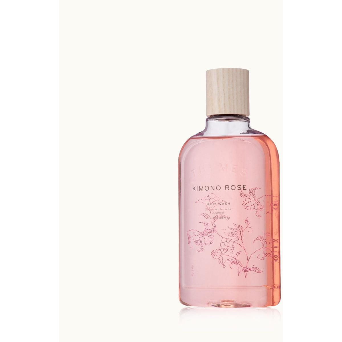 Pink bottle of Kimono Rose body wash on a white background